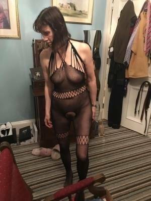 Older amateur Slut Scot Susan shows her beaver on a bed in a bodystocking on shefanatics.com