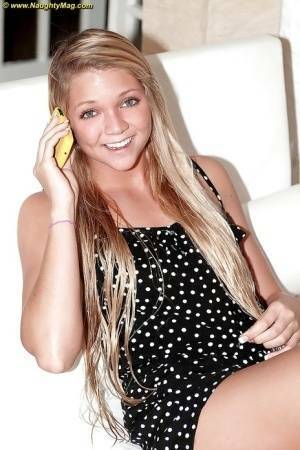 Blonde cutie Jessie Andrews shows it all on her couch. on shefanatics.com