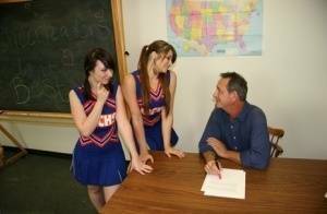 2 cheerleaders jerk off their geography teacher on top of his desk on shefanatics.com