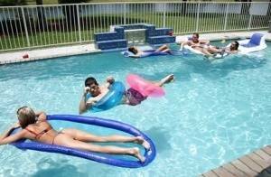 Frolic girls in bikini flashing their tits at the pool party on shefanatics.com