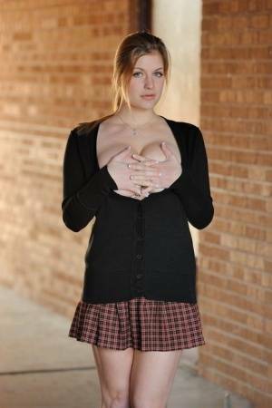 Amateur abbe letting big natural schoolgirl tits loose outdoors in socks on shefanatics.com