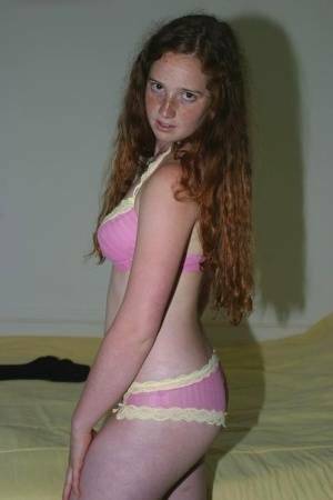 Flexible redhead Rachel showcases her natural pussy after lingerie removal on shefanatics.com