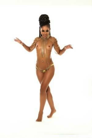 Scary ebony MILF Skin Diamond shows her fangs while posing her hot naked body on shefanatics.com
