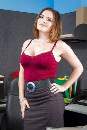 Secretary Krissy Lynn shows her fuckable booty in the office on shefanatics.com