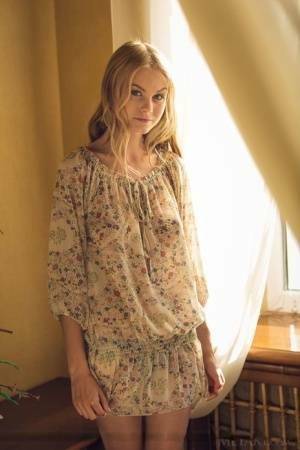 Cute blonde teen Nancy A slips off her floral dress to model naked on shefanatics.com