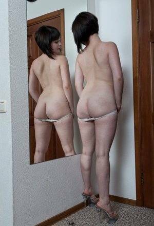 White teen with a full bush admires herself in mirror while disrobing on shefanatics.com