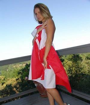 Canadian teen Karen wraps her naked body in a flag on her back deck on shefanatics.com