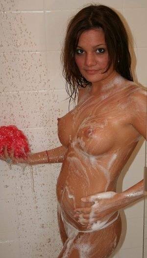 Teen amateur Kate Crush soaps her perky breasts while taking a shower on shefanatics.com