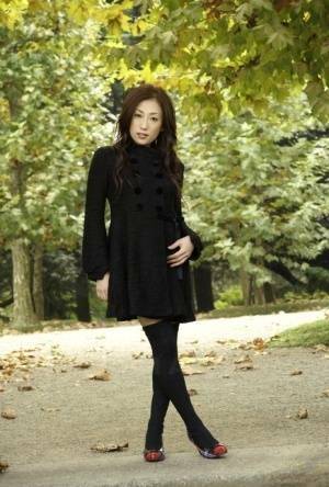 Fully clothed Japanese teen models in the park in black clothes and stockings - Japan on shefanatics.com