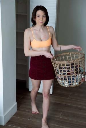 Young brunette Riley Jean makes her nude debut on a bed during laundry day on shefanatics.com