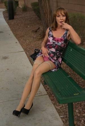 Aged lady flashes her tits and twat on a public bench before disrobing at home on shefanatics.com