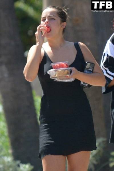 Addison Rae Indulges in Some Refreshing Watermelon While Out in a Tight Skirt with Her Boyfriend on shefanatics.com