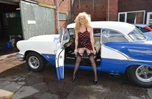 Blond amateur Barby Slut flashes by a vintage auto before sex at home on a bed on shefanatics.com