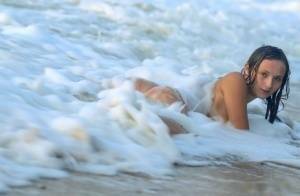 18-year-old beauty Tressa G strikes great nude poses in ocean surf on shefanatics.com