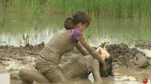 Two women have a romantic time in mud Thothub on shefanatics.com