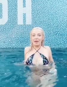 Tana Mongeau pool on shefanatics.com