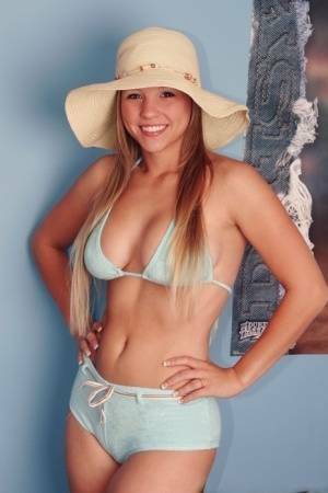 Solo girl Dawson Miller takes off her bikini while wearing a floppy sun hat on shefanatics.com