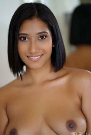 Beautiful Latina teen Alika Penagos gets totally naked on a chair on shefanatics.com