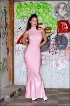 Latina beauty Ryan Keely inserts a vibrator after removing a long latex dress on shefanatics.com