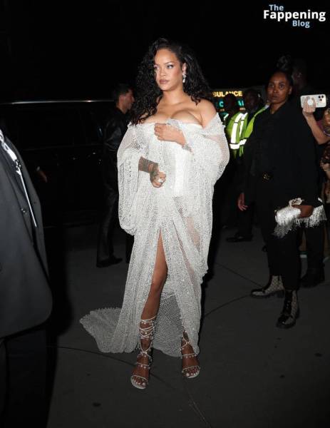 Rihanna Displays Her Curves in a White Dress (13 Photos) on shefanatics.com